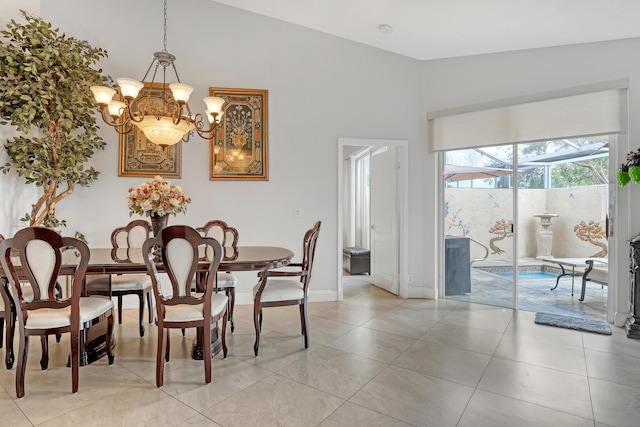 dining space featuring lofted ceiling, light tile patterned floors, and a chandelier