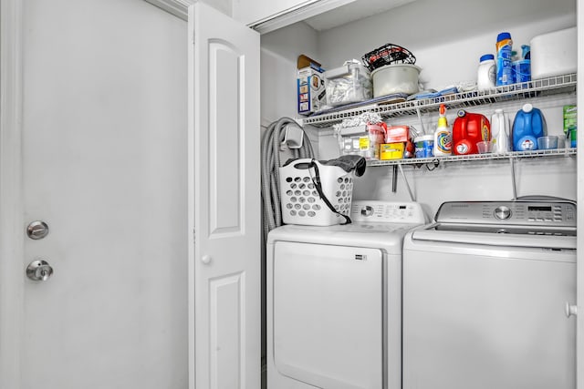 washroom featuring independent washer and dryer