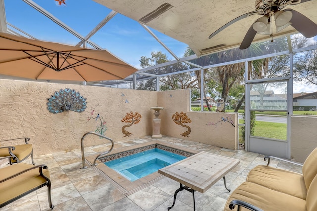 view of pool featuring an in ground hot tub, glass enclosure, and a patio area