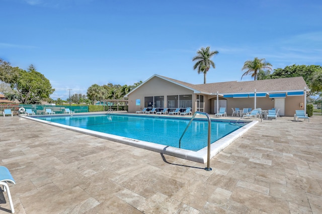 view of swimming pool with a patio