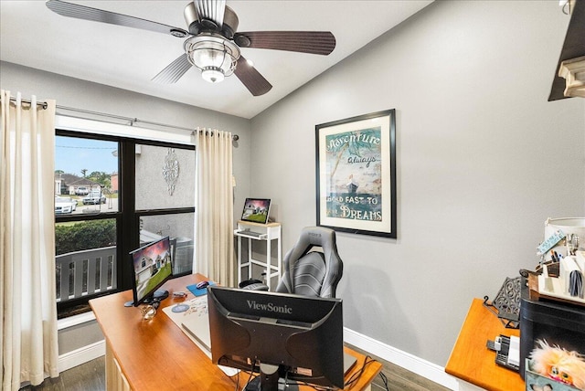 office space with dark hardwood / wood-style flooring, ceiling fan, and lofted ceiling