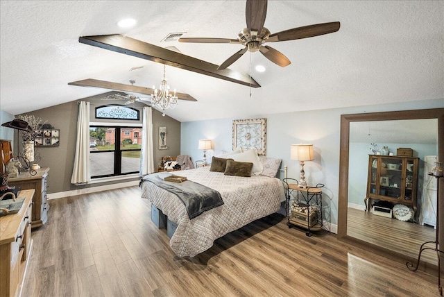 bedroom featuring a textured ceiling, hardwood / wood-style flooring, vaulted ceiling with beams, and ceiling fan