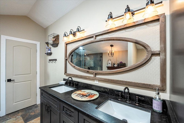 bathroom with vanity, vaulted ceiling, and an enclosed shower