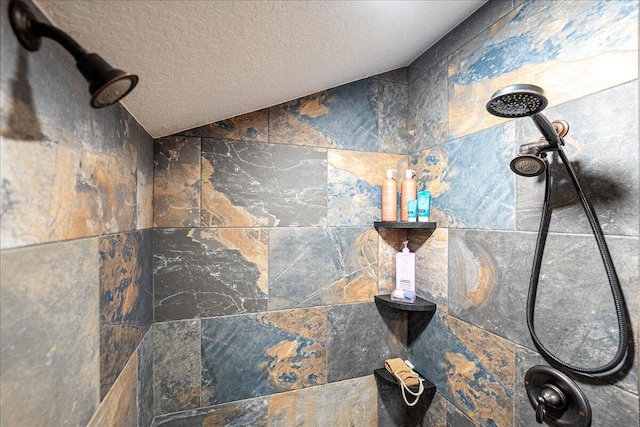 details with a tile shower and a textured ceiling