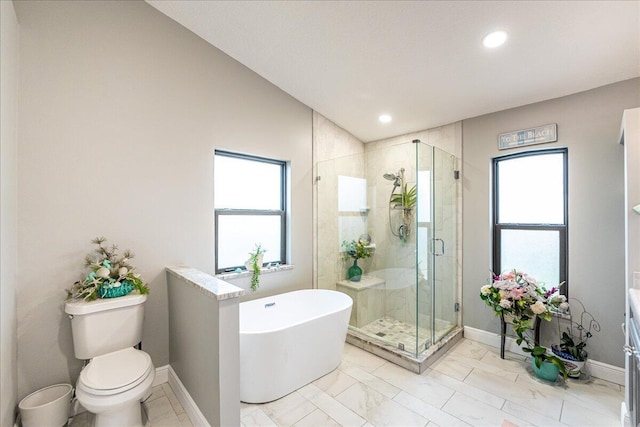 bathroom with plus walk in shower, toilet, and a healthy amount of sunlight