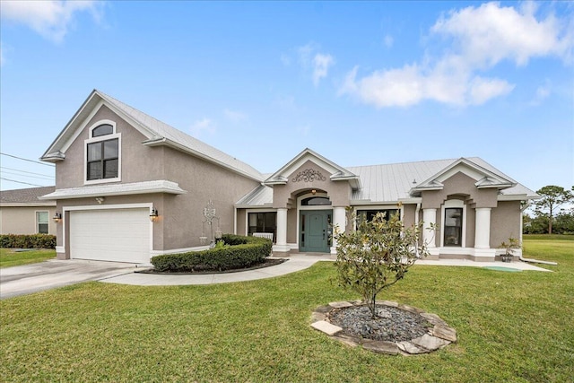 view of front of home featuring a front yard and a garage