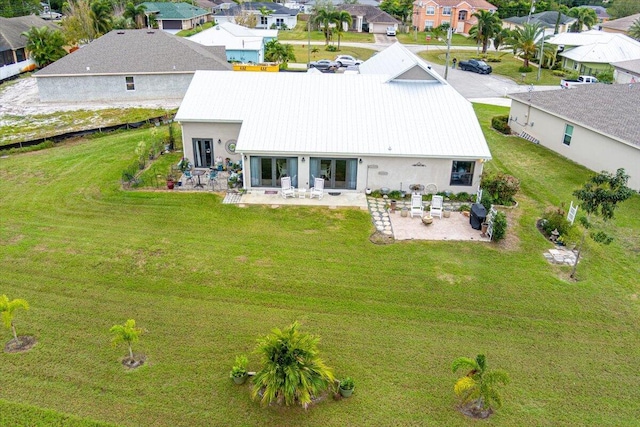 back of property featuring a patio area