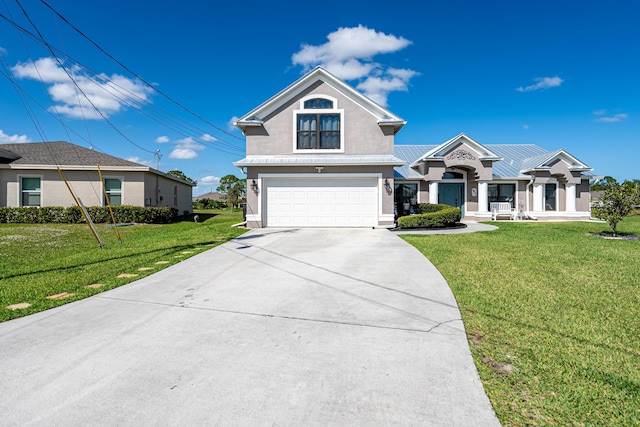 view of front of house with a front yard and a garage