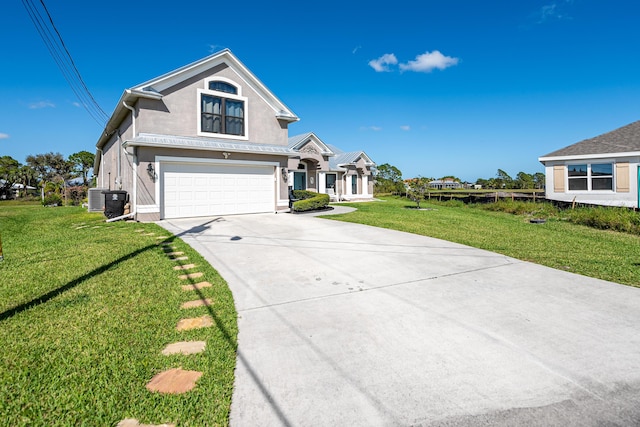 view of front facade with a front lawn, a garage, and cooling unit