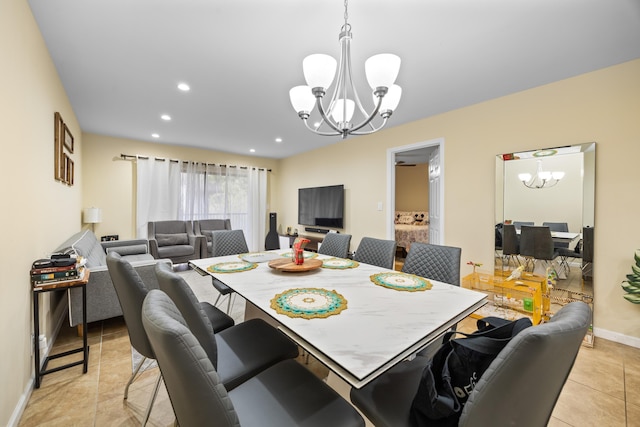 tiled dining area featuring a chandelier