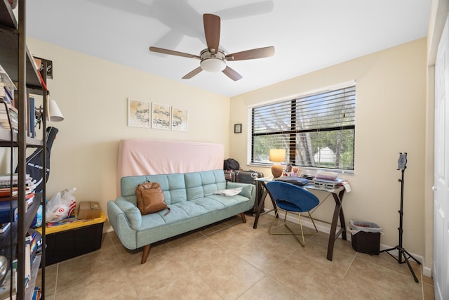 tiled office space featuring ceiling fan