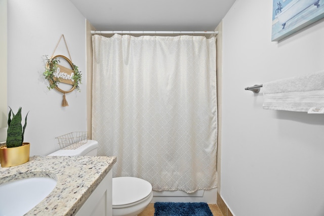 full bathroom featuring toilet, vanity, and shower / tub combo with curtain