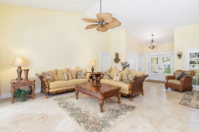 living room featuring an inviting chandelier, high vaulted ceiling, and french doors