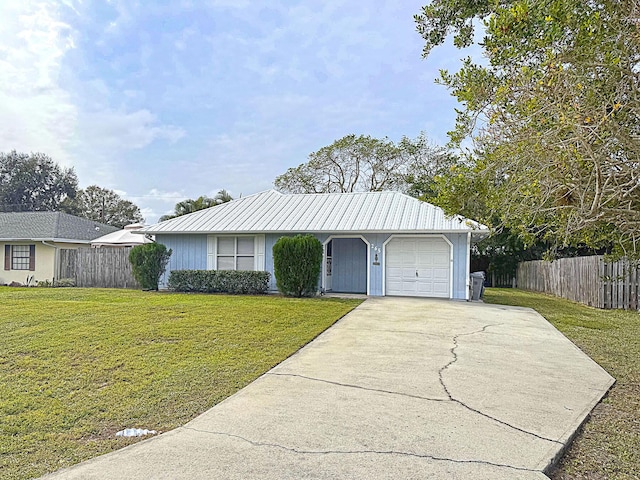 ranch-style home with a front yard and a garage