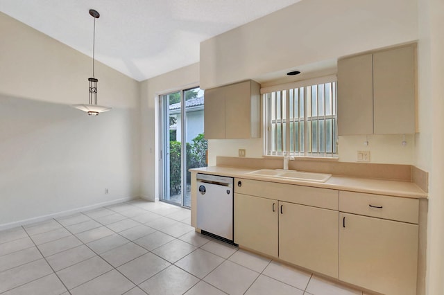 kitchen with lofted ceiling, sink, dishwasher, pendant lighting, and cream cabinetry