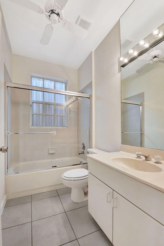 full bathroom with tile patterned flooring, vanity, combined bath / shower with glass door, and ceiling fan