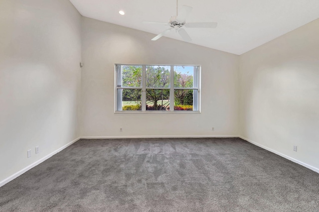 carpeted spare room with ceiling fan and lofted ceiling