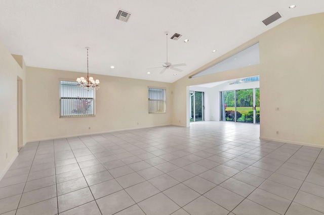 spare room featuring high vaulted ceiling, ceiling fan with notable chandelier, and light tile patterned floors