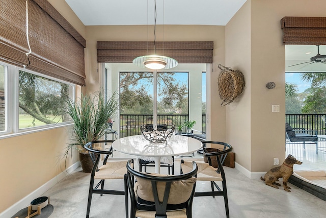 interior space featuring a wealth of natural light and a ceiling fan