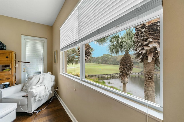 bedroom featuring baseboards and dark wood finished floors