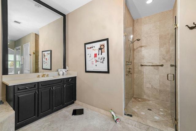 bathroom featuring vanity, tile patterned floors, and an enclosed shower