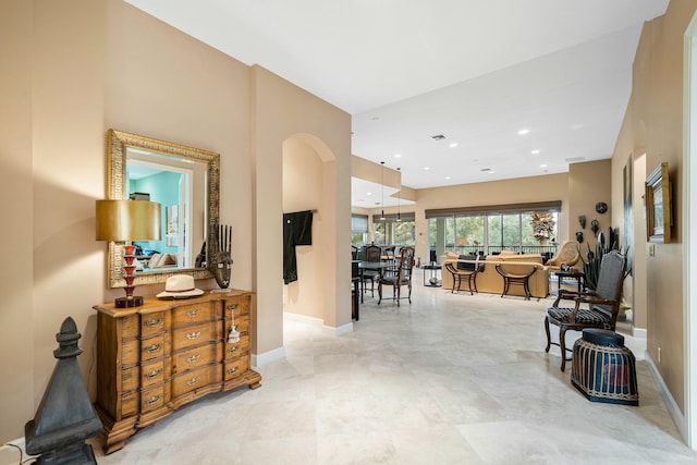 interior space featuring baseboards and recessed lighting