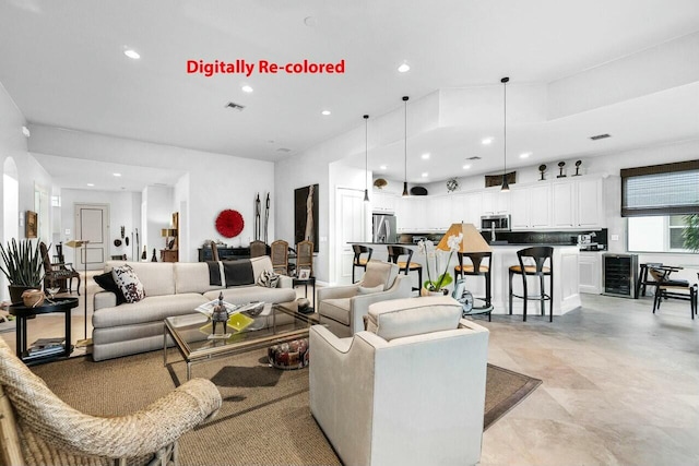 living room featuring beverage cooler, visible vents, and recessed lighting