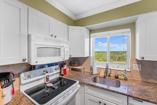 kitchen with white appliances, white cabinets, crown molding, backsplash, and sink