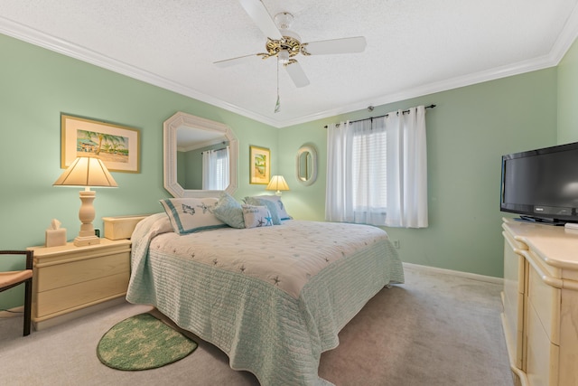 carpeted bedroom featuring ceiling fan, crown molding, and a textured ceiling