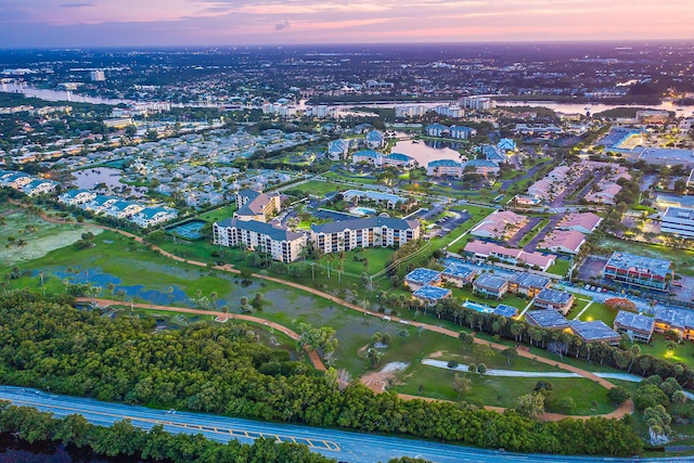 aerial view at dusk with a water view