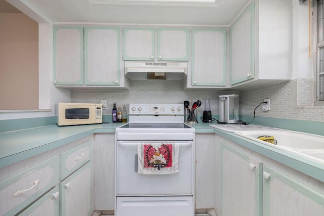 kitchen with backsplash and white appliances