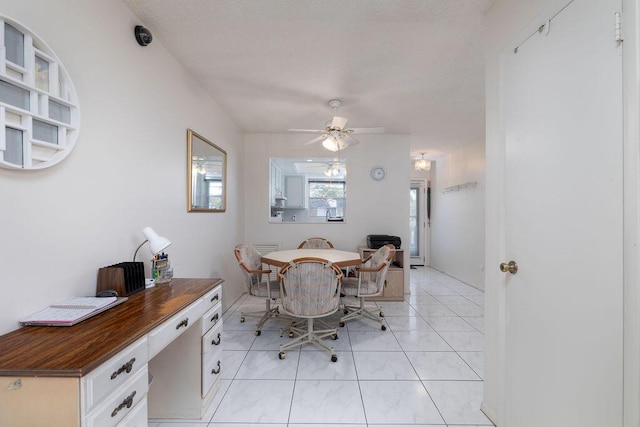 dining room with light tile patterned flooring and ceiling fan