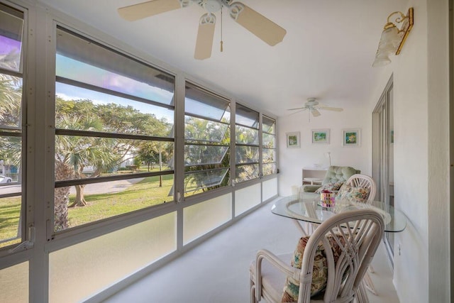 sunroom / solarium with plenty of natural light and ceiling fan