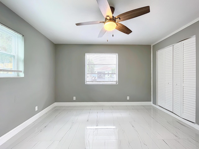 spare room with ceiling fan