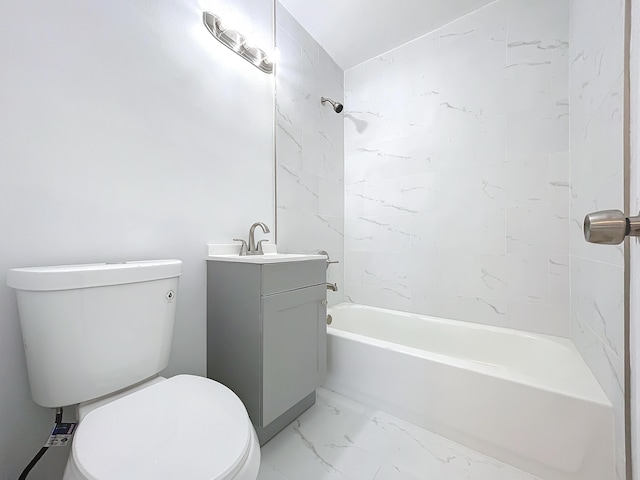 full bathroom with toilet, vanity, and tiled shower / bath combo