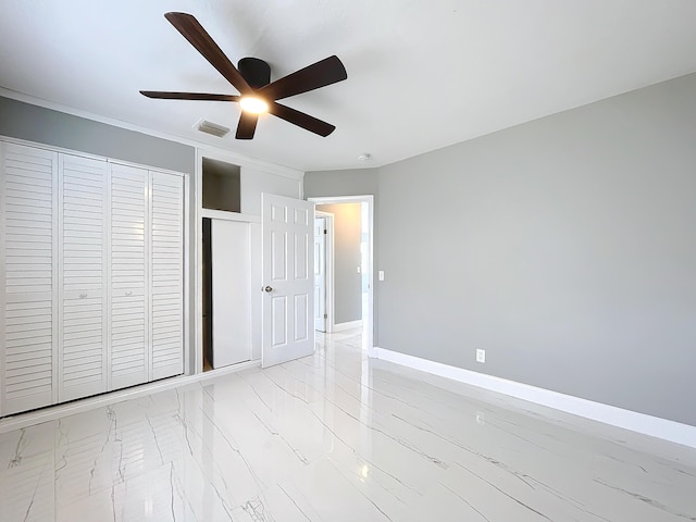 unfurnished bedroom featuring ceiling fan