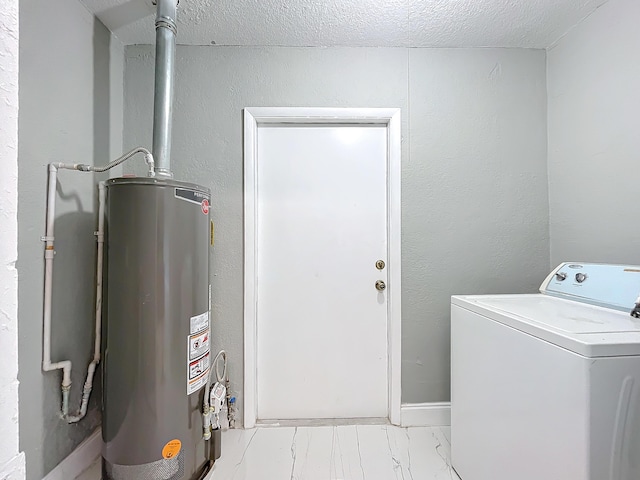 laundry area with a textured ceiling, washer / clothes dryer, and gas water heater