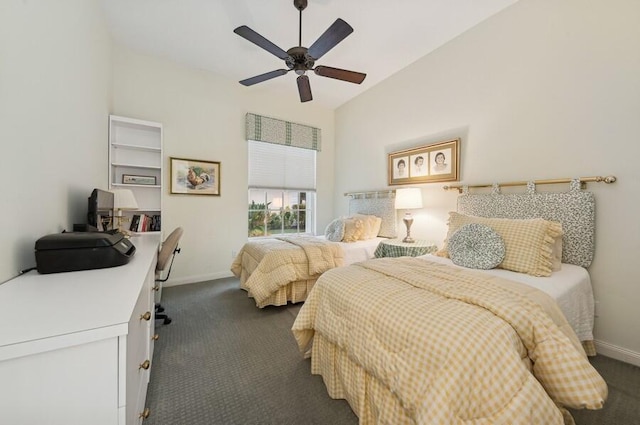 bedroom featuring ceiling fan and dark carpet