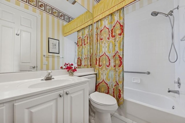 full bathroom featuring vanity, shower / tub combo, and toilet