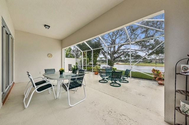 view of patio with glass enclosure