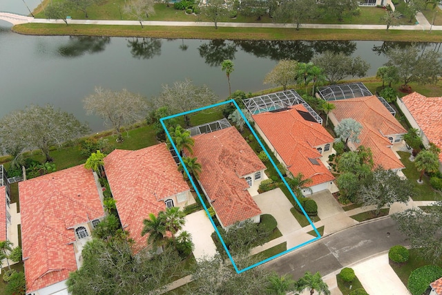 birds eye view of property featuring a water view