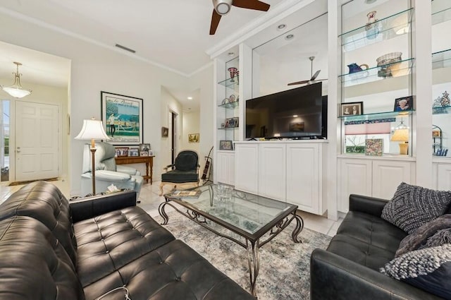 living room with ornamental molding, plenty of natural light, light tile patterned floors, and ceiling fan