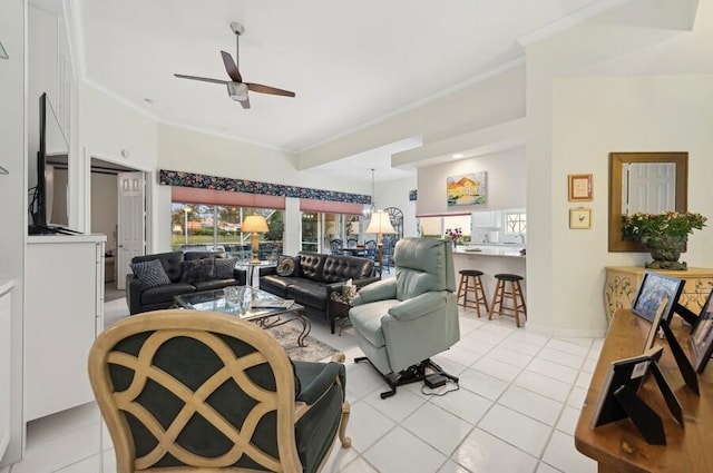 tiled living room featuring ceiling fan and ornamental molding