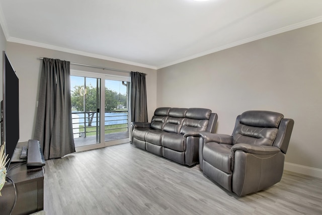 living room with crown molding and light hardwood / wood-style floors