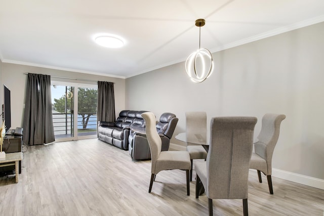 dining space with crown molding and wood-type flooring