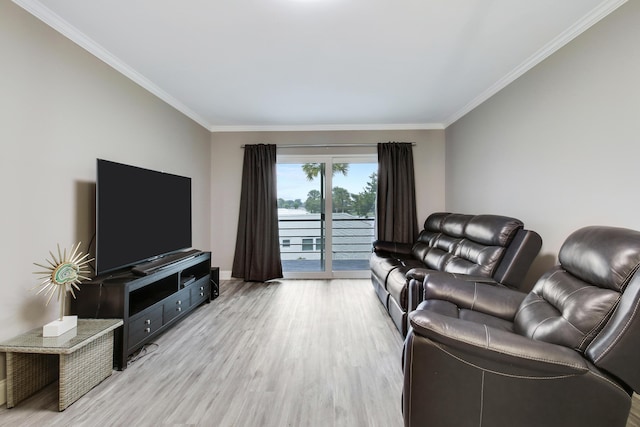 living room with crown molding and light hardwood / wood-style floors