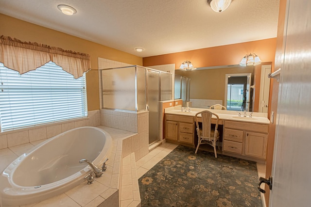 bathroom with tile patterned flooring, vanity, and plus walk in shower