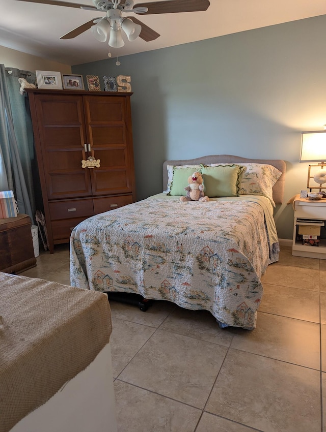 bedroom featuring tile patterned flooring and ceiling fan