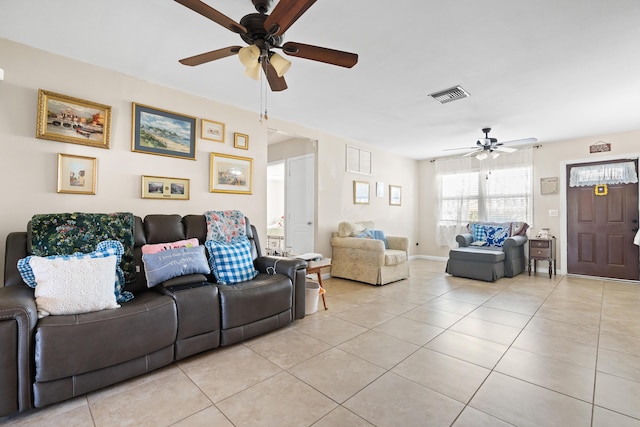 tiled living room featuring ceiling fan