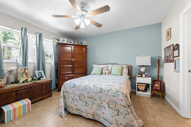 tiled bedroom featuring ceiling fan